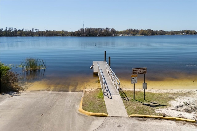10219 Huntley St, New Port Richey, FL 34654 - dock with a boat ramp and a water view