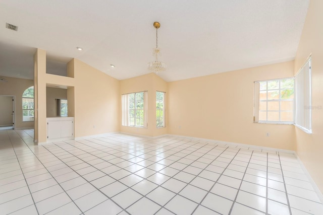 921 Linn Harbor Ct, Tarpon Springs, FL 34689 - unfurnished room featuring vaulted ceiling, healthy amount of natural light, light tile patterned flooring, and baseboards