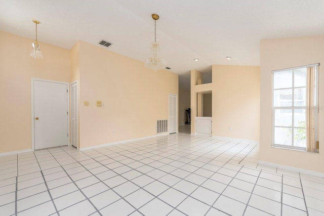 921 Linn Harbor Ct, Tarpon Springs, FL 34689 - empty room featuring a chandelier, high vaulted ceiling, and baseboards