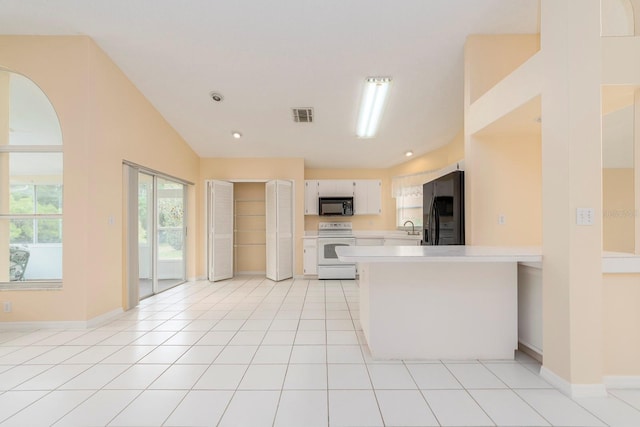 921 Linn Harbor Ct, Tarpon Springs, FL 34689 - kitchen with black appliances, light countertops, a peninsula, a sink, and baseboards