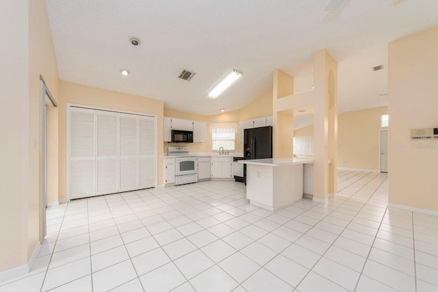 921 Linn Harbor Ct, Tarpon Springs, FL 34689 - kitchen with black appliances, light countertops, lofted ceiling, a peninsula, and a sink