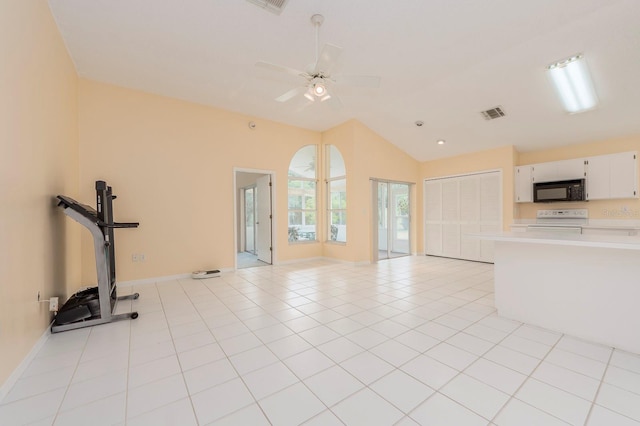 921 Linn Harbor Ct, Tarpon Springs, FL 34689 - unfurnished living room with vaulted ceiling, baseboards, ceiling fan, and light tile patterned floors
