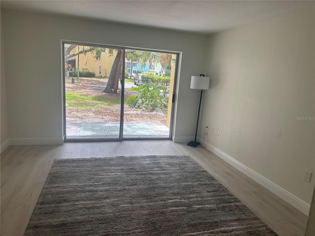 3640 41st Ln S Unit F, Saint Petersburg, FL 33711 - empty room with wood finished floors and baseboards