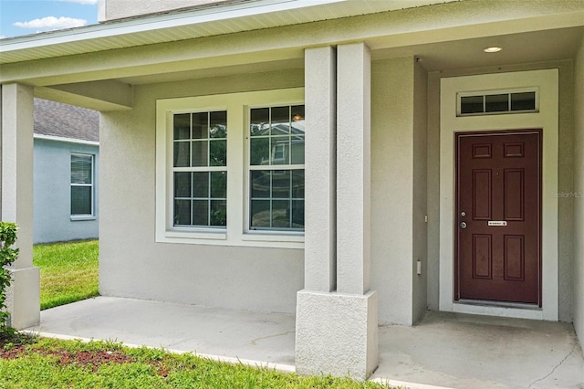 7509 Tangle Bend Dr, Gibsonton, FL 33534 - view of exterior entry with stucco siding