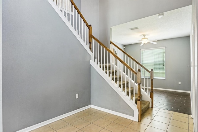 7509 Tangle Bend Dr, Gibsonton, FL 33534 - stairway with a ceiling fan and tile patterned flooring