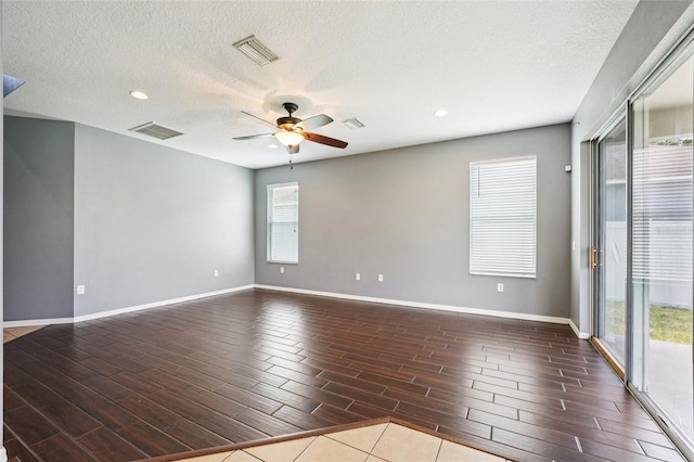 7509 Tangle Bend Dr, Gibsonton, FL 33534 - empty room with a ceiling fan, wood tiled floors, recessed lighting, and a textured ceiling