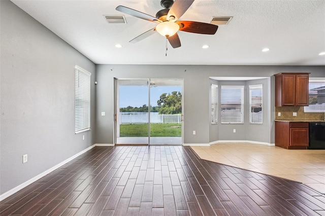 7509 Tangle Bend Dr, Gibsonton, FL 33534 - unfurnished living room with ceiling fan, recessed lighting, wood finished floors, and a water view