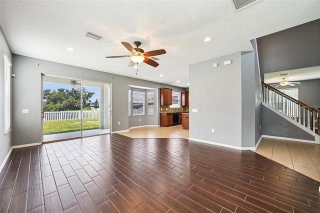 7509 Tangle Bend Dr, Gibsonton, FL 33534 - unfurnished living room featuring ceiling fan, wood finished floors, stairway, and recessed lighting