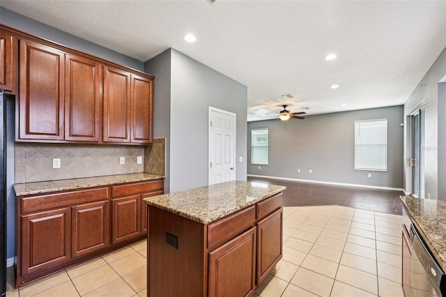 7509 Tangle Bend Dr, Gibsonton, FL 33534 - kitchen featuring light tile patterned flooring, ceiling fan, backsplash, stainless steel dishwasher, and recessed lighting