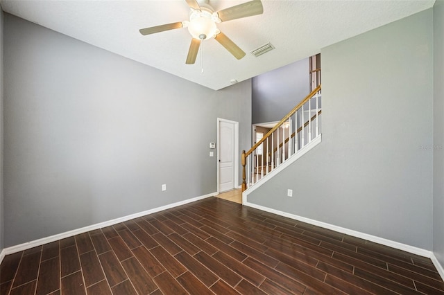 7509 Tangle Bend Dr, Gibsonton, FL 33534 - empty room with ceiling fan, wood finished floors, and stairway