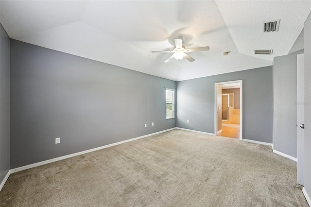 7509 Tangle Bend Dr, Gibsonton, FL 33534 - unfurnished bedroom featuring carpet floors, a ceiling fan, connected bathroom, and lofted ceiling