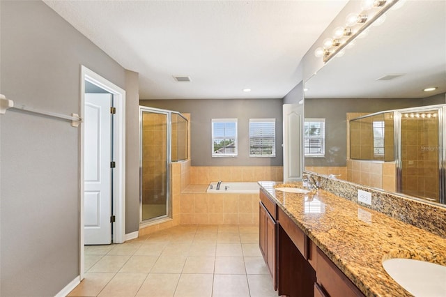 7509 Tangle Bend Dr, Gibsonton, FL 33534 - full bath featuring tile patterned floors, double vanity, a garden tub, a shower stall, and recessed lighting