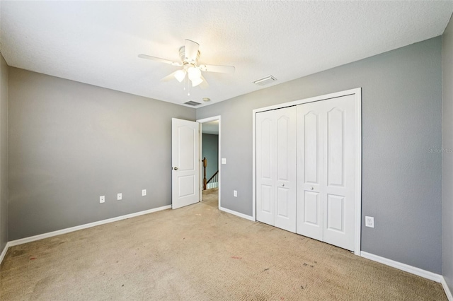 7509 Tangle Bend Dr, Gibsonton, FL 33534 - unfurnished bedroom featuring carpet, a closet, and a ceiling fan