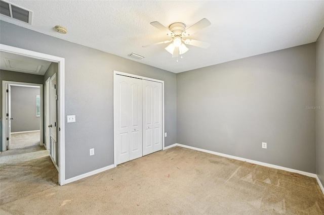 7509 Tangle Bend Dr, Gibsonton, FL 33534 - unfurnished bedroom featuring carpet floors, a closet, attic access, and a ceiling fan