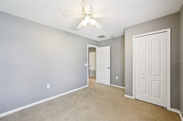 7509 Tangle Bend Dr, Gibsonton, FL 33534 - unfurnished bedroom with carpet, a closet, and a ceiling fan
