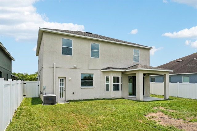 7509 Tangle Bend Dr, Gibsonton, FL 33534 - back of property with stucco siding, a patio, a fenced backyard, and a gate
