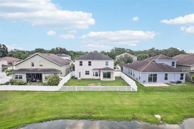 7509 Tangle Bend Dr, Gibsonton, FL 33534 - back of property with a fenced backyard and a residential view
