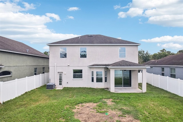 7509 Tangle Bend Dr, Gibsonton, FL 33534 - back of property featuring a patio area, stucco siding, a fenced backyard, and a shingled roof