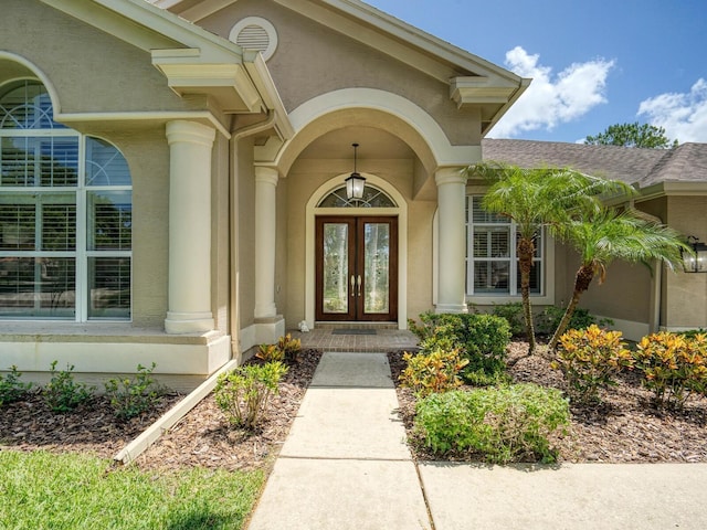 4335 Clairidge Way, Palm Harbor, FL 34685 - property entrance featuring french doors and stucco siding
