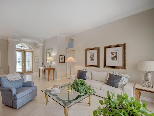 4335 Clairidge Way, Palm Harbor, FL 34685 - living room with decorative columns, crown molding, french doors, light tile patterned floors, and arched walkways