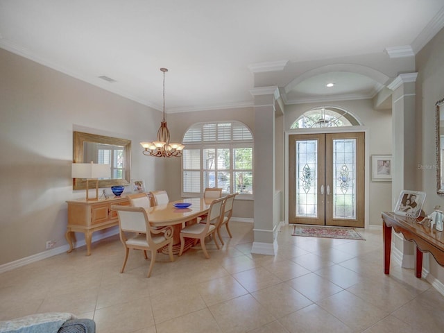 4335 Clairidge Way, Palm Harbor, FL 34685 - dining area featuring a chandelier, french doors, plenty of natural light, ornamental molding, and arched walkways