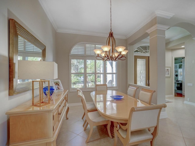 4335 Clairidge Way, Palm Harbor, FL 34685 - dining room featuring light tile patterned floors, ornamental molding, healthy amount of natural light, arched walkways, and a chandelier