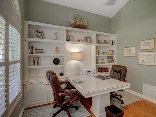 4335 Clairidge Way, Palm Harbor, FL 34685 - office area featuring wood finished floors and baseboards