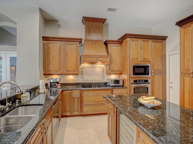 4335 Clairidge Way, Palm Harbor, FL 34685 - kitchen with appliances with stainless steel finishes, premium range hood, beverage cooler, dark stone counters, and tasteful backsplash