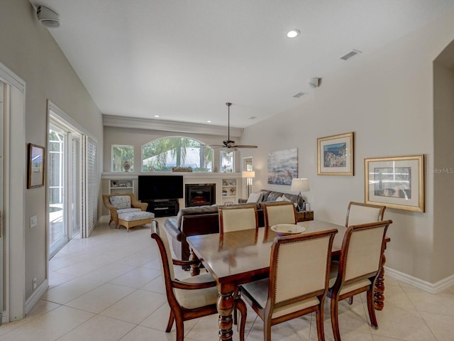 4335 Clairidge Way, Palm Harbor, FL 34685 - dining area featuring a ceiling fan, light tile patterned flooring, a glass covered fireplace, and recessed lighting