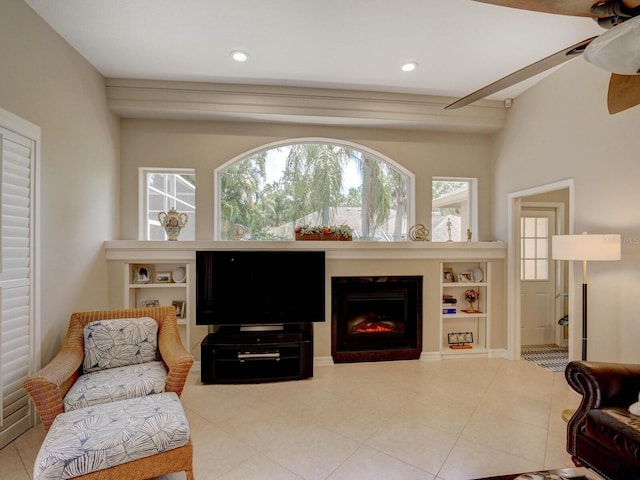 4335 Clairidge Way, Palm Harbor, FL 34685 - living room with ceiling fan, a lit fireplace, plenty of natural light, tile patterned flooring, and recessed lighting