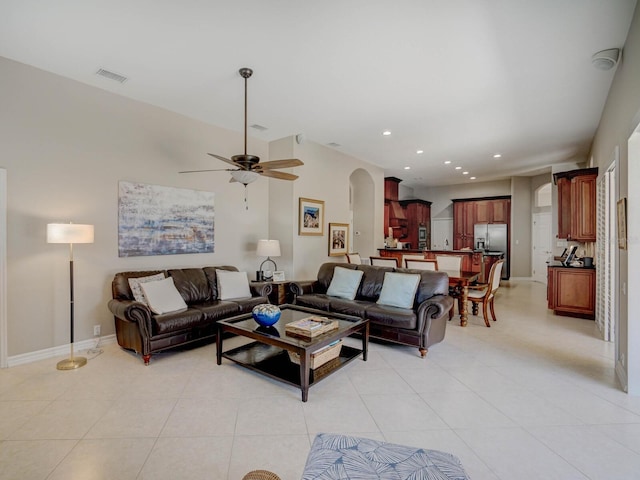 4335 Clairidge Way, Palm Harbor, FL 34685 - living room featuring arched walkways, ceiling fan, light tile patterned floors, and recessed lighting