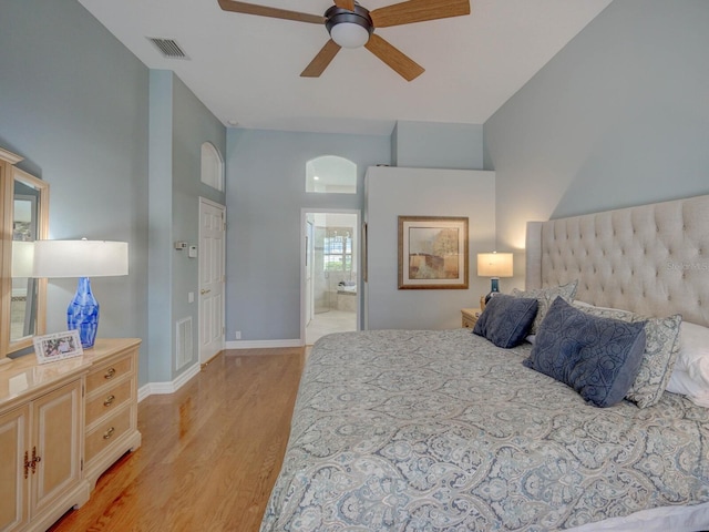 4335 Clairidge Way, Palm Harbor, FL 34685 - bedroom with light wood finished floors, ensuite bathroom, and ceiling fan