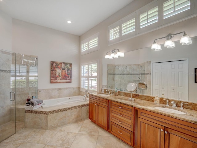 4335 Clairidge Way, Palm Harbor, FL 34685 - full bathroom featuring a garden tub, double vanity, a shower stall, tile patterned flooring, and a towering ceiling