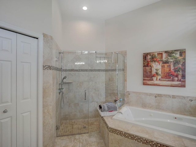 4335 Clairidge Way, Palm Harbor, FL 34685 - bathroom with a garden tub, a shower stall, and tile patterned floors