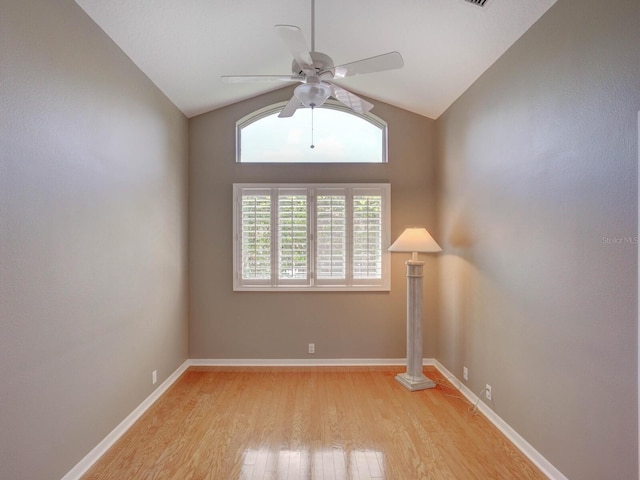 4335 Clairidge Way, Palm Harbor, FL 34685 - empty room with lofted ceiling, light wood finished floors, and ceiling fan