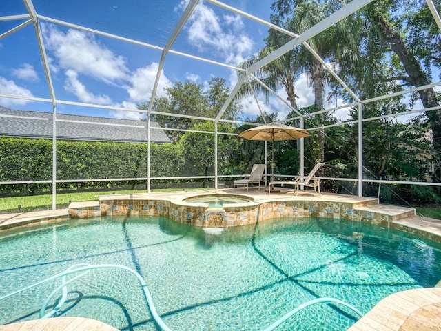 4335 Clairidge Way, Palm Harbor, FL 34685 - view of pool featuring glass enclosure, a patio area, and a pool with connected hot tub