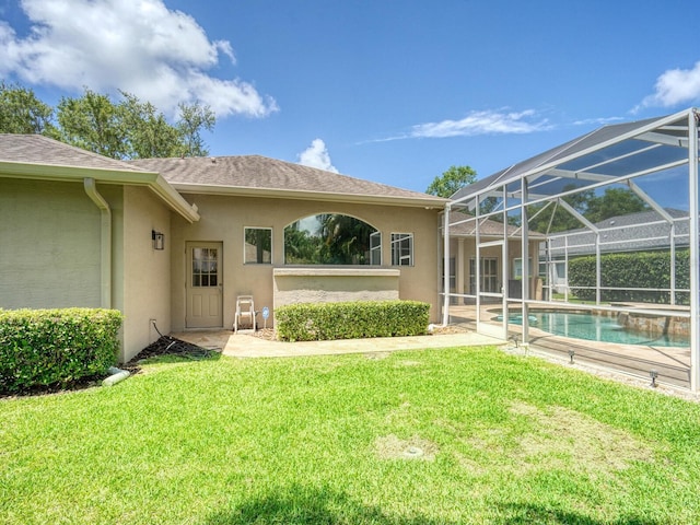 4335 Clairidge Way, Palm Harbor, FL 34685 - property entrance featuring stucco siding, a lawn, an outdoor pool, and a shingled roof