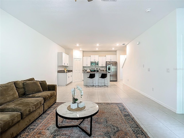 4567 Tuscan Loon Dr, Tampa, FL 33619 - living area with light tile patterned floors and recessed lighting