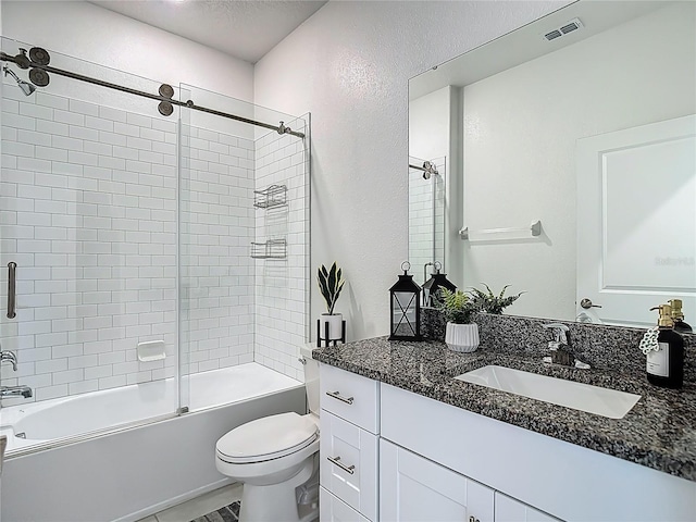 4567 Tuscan Loon Dr, Tampa, FL 33619 - bathroom with vanity, enclosed tub / shower combo, a textured wall, and a textured ceiling