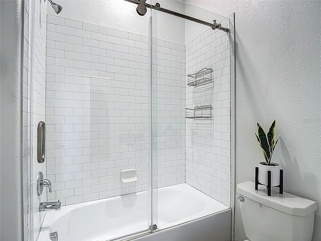 4567 Tuscan Loon Dr, Tampa, FL 33619 - full bathroom with a textured wall and bath / shower combo with glass door