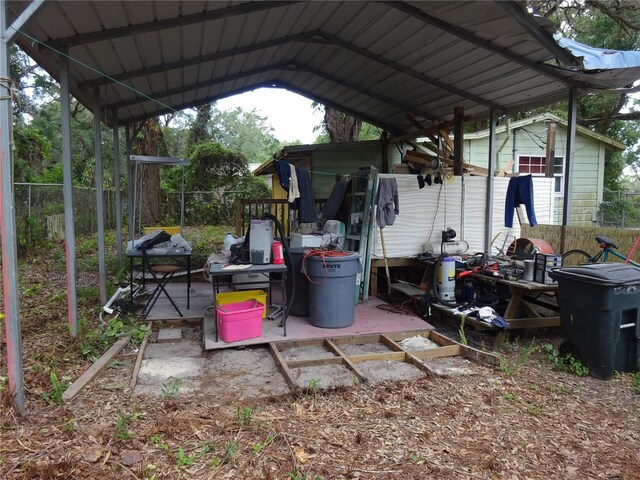 8617 Broad St, New Port Richey, FL 34654 - view of parking / parking lot featuring a detached carport