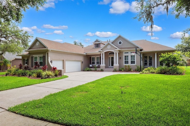 5823 Terncrest Dr, Lithia, FL 33547 - view of front of home with a garage, a front lawn, stucco siding, and french doors