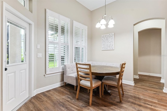 5823 Terncrest Dr, Lithia, FL 33547 - dining space with wood finished floors, arched walkways, and a chandelier
