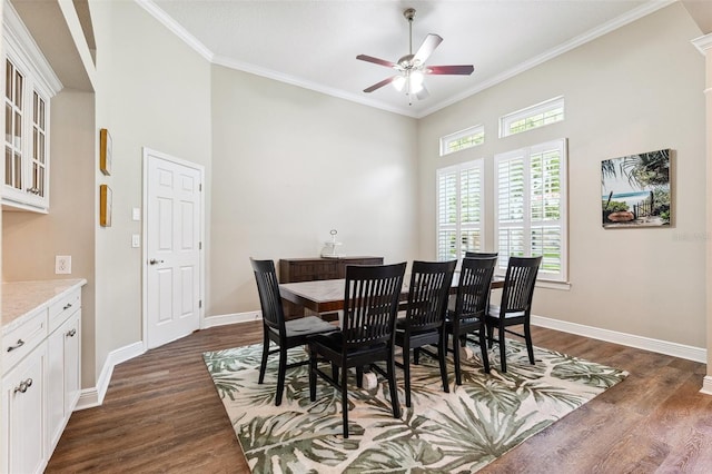 5823 Terncrest Dr, Lithia, FL 33547 - dining space featuring dark wood-type flooring, a ceiling fan, ornamental molding, and a towering ceiling