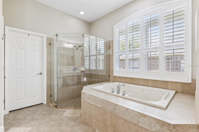 5823 Terncrest Dr, Lithia, FL 33547 - full bathroom featuring a bath, a shower stall, tile patterned floors, and recessed lighting
