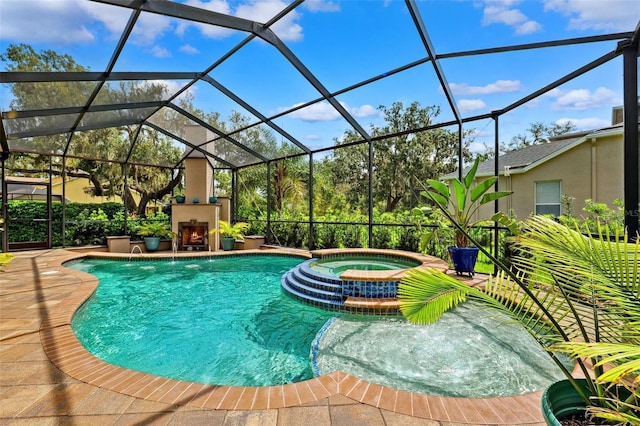 5823 Terncrest Dr, Lithia, FL 33547 - view of pool featuring a lit fireplace, a pool with connected hot tub, a patio, and a lanai