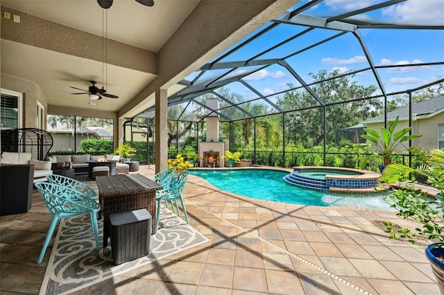 5823 Terncrest Dr, Lithia, FL 33547 - view of swimming pool with ceiling fan, an outdoor living space with a fireplace, a patio, and a pool with connected hot tub