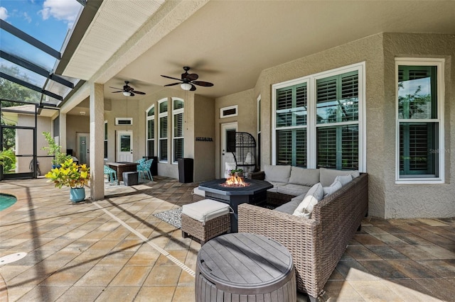 5823 Terncrest Dr, Lithia, FL 33547 - view of patio / terrace with an outdoor living space with a fire pit, a ceiling fan, and glass enclosure