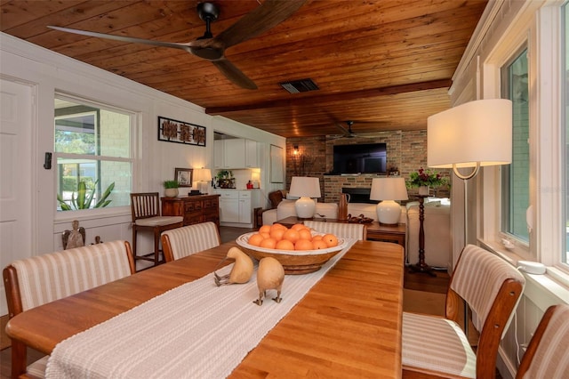 19209 Crooked Ln, Lutz, FL 33548 - dining space with a ceiling fan, wood finished floors, wooden ceiling, and a fireplace