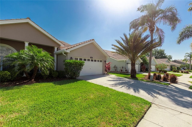 1729 Arabian Ln, Palm Harbor, FL 34685 - view of front of house featuring stucco siding, a front lawn, an attached garage, and driveway